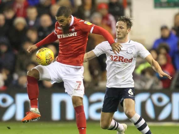 Ben Davies challenges Lewis Grabban in the game between PNE and Nottingham Forest at the City Ground earlier in the season