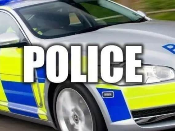 A man is fighting for his life after thieves stole his car and ploughed into him outside his home.