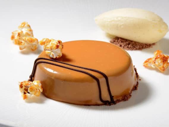 Chocolate mousse dessert with caramel glaze and salted caramel popcorn