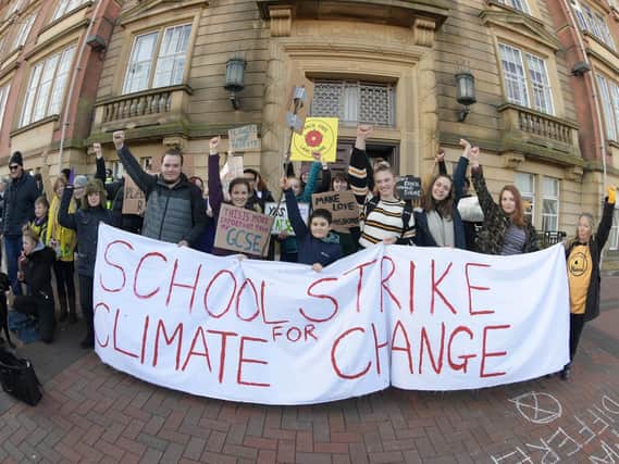 Young protesters campaigning on climate change outside Lancashire County Council's offices in Preston