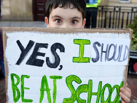 Amos Rand protesting in Preston city centre