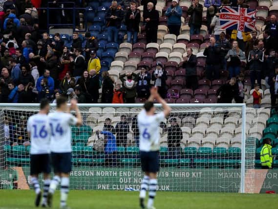 The Preston players salute the fans at the final whistle