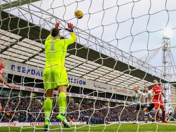 Jordan Storey looks on as Costel Pantilimon makes a save at Deepdale on Saturday