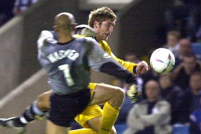 Richard Cresswell for Preston North End clashes with the Millwall goalkeeper.