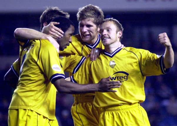 Paul McKenna celebrates his goal for Preston North End with team mates over Millwall.