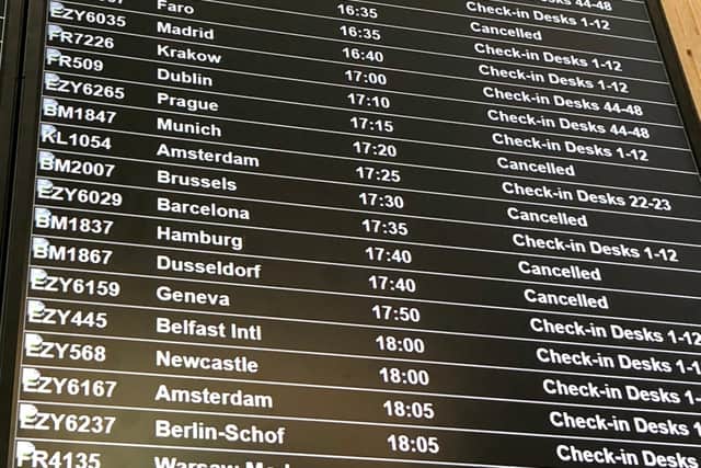 A departure board at Bristol Airport showing flybmi flights cancelled following the collapse of the airline