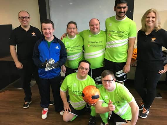 Caritas Cares Vision in People (VIP) Football Team, with a new football kit, sponsored by Web Design Company Scruffymonkey.