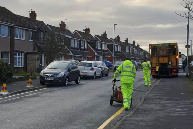 Workmen from Lancashire County Council could be seen in Broadwood Drive, Fulwood, today painting single yellow lines to restrict parking between the hours of 8am and 5pm