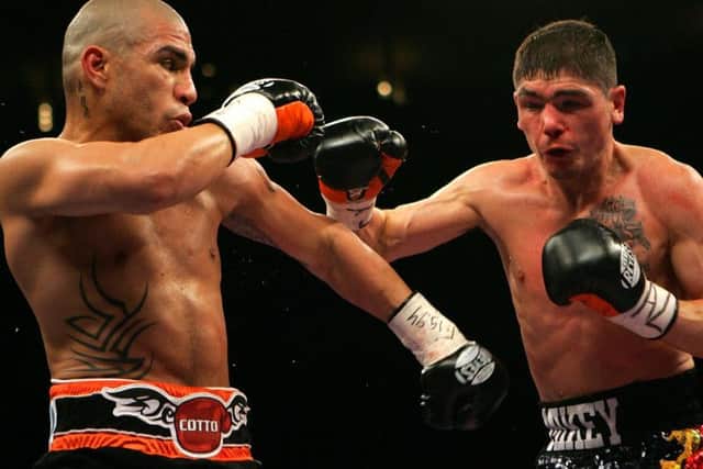 Michael Jennings goes on the offensive against Miguel Cotto on his big night in New York 10 years ago. Picture: Getty Images