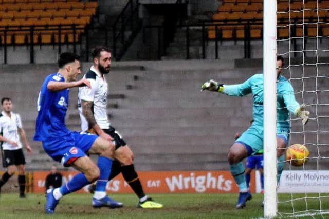 Aaron Collins has scored winners at Port Vale (above) and Oldham Athletic within the last week for Morecambe