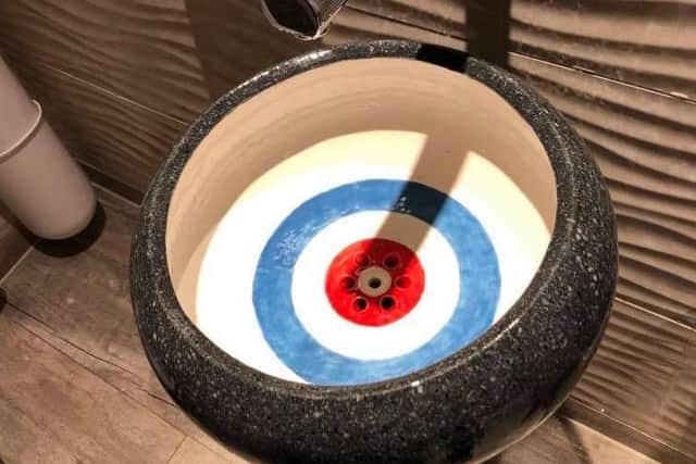 A curling-themed sink at The Flower Bowl