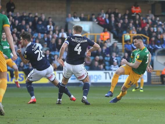 Andrew Hughes fires home PNE's opener at Millwall on Saturday