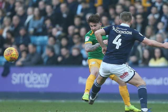 Sean Maguire tries to get the better of Shaun Hutchinson at The Den