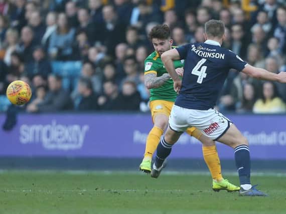 Sean Maguire tries to get the better of Shaun Hutchinson at The Den