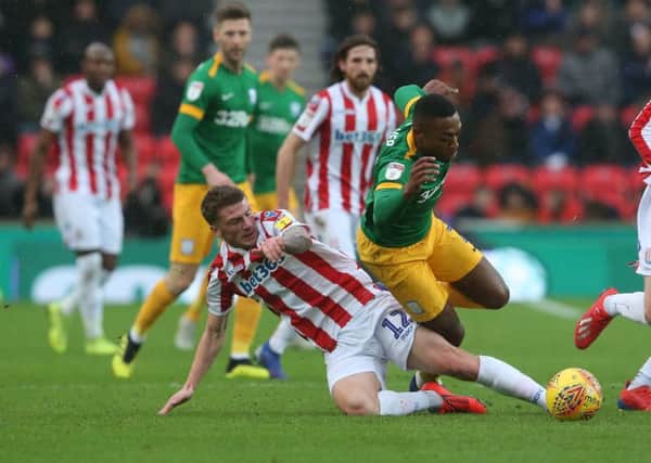 Darnell Fisher is tackled by Stoke's Josh Tymon in the 2-0 victory at the bet365 Stadium in January