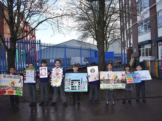 Youngsters from The Olive School  with their posters