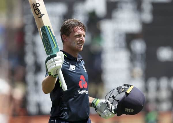 Jos Buttler raises his bat as he leaves the field