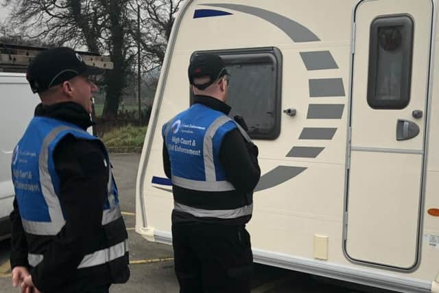 Court enforcement officers at the site in Euxton this morning