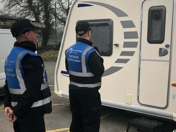 Court enforcement officers at the site in Euxton this morning