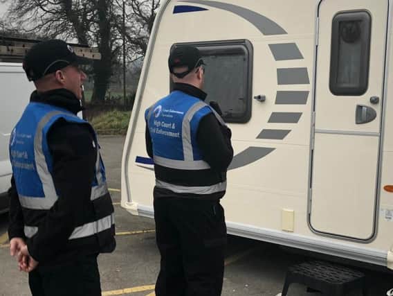 Court enforcement officers at the site in Euxton this morning