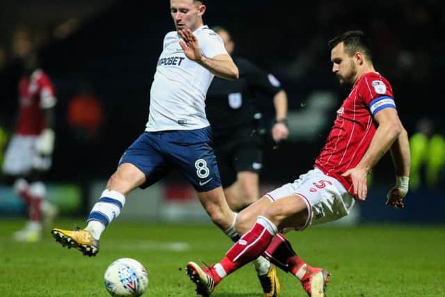 Alan Browne does battle with Bailey Wright during last season's game at Deepdale