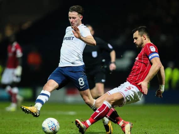 Alan Browne does battle with Bailey Wright during last season's game at Deepdale
