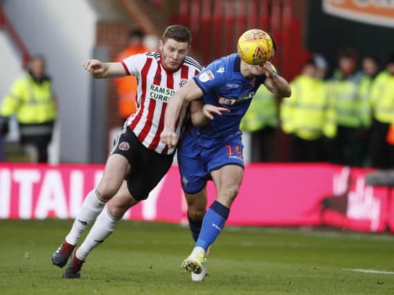 Jack OConnell of Sheffield Utd and Jack Hobbs of Bolton Wanderers during the Sky Bet Championship match at the Bramall Lane Stadium