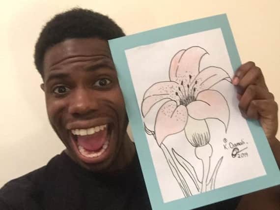 Apprentice 2018 candidate Kayode Damal with the artwork her drew for the auction