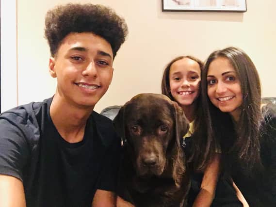 Natalie Kerr, who was given a double lung transplant seven years ago. Pictured with her children Isabelle and Brandon and the family dog, Coco.