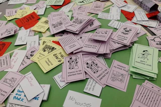 Cards on the table over green space in Leyland
