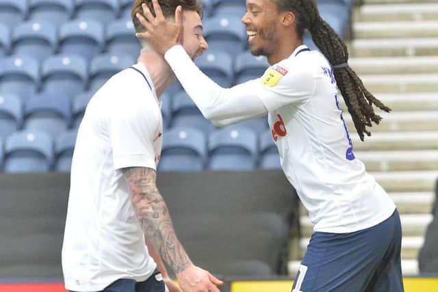 Sean Maguire congratulates Johnson on his goal just before half-time at Deepdale