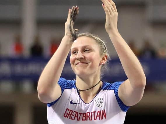 Holly Bradshaw applauds the crowds after taking silver at the European Indoor Championships