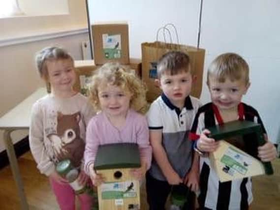 Youngsters at Charnock Richard Preschool handed over bird boxes, feeders and bird food to the Orchard Gardens renovation project.