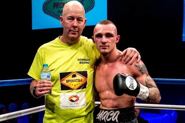 Reece MacMillan celebrates victory with trainer John Donaghy. Picture: Kevin Gilbo/Eat Sleep Boxing Repeat