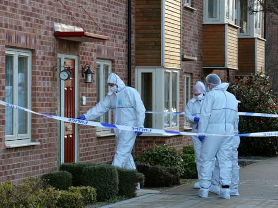 Police forensic officers at the scene of the house of Paul Newman, after he killed his wife and children in 2016.