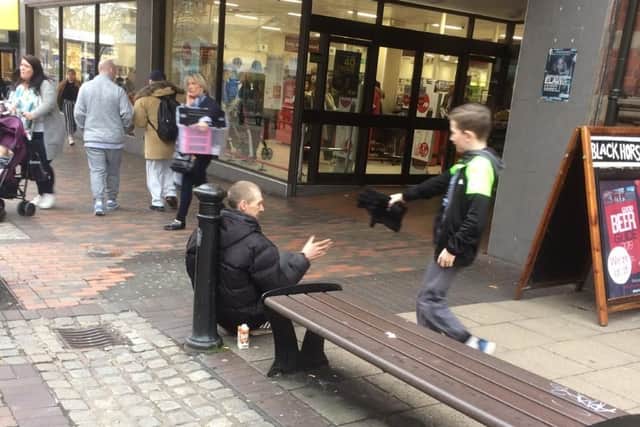 Cody offers a helping hand to a homeless man in Preston