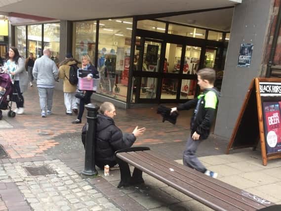 Cody offers a helping hand to a homeless man in Preston