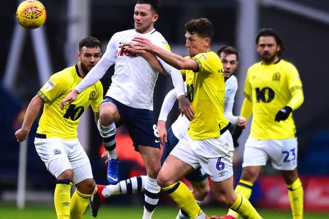 Preston North End's Alan Browne vies for possession with Blackburn Rovers' Richard Smallwood during the first meeting between the teams this season at Deepdale