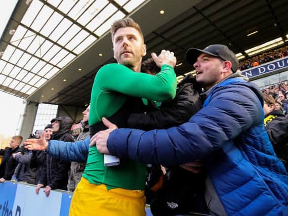 Paul Gallagher celebrates with the Preston fans at the final whistle