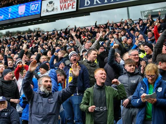 Preston fans celebrate their side taking the lead