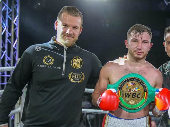 Isaac Lowe celebrates victory in Essex on Saturday night with trainer Ben Davison . Picture: Scott Rawsthorne for MTK Global