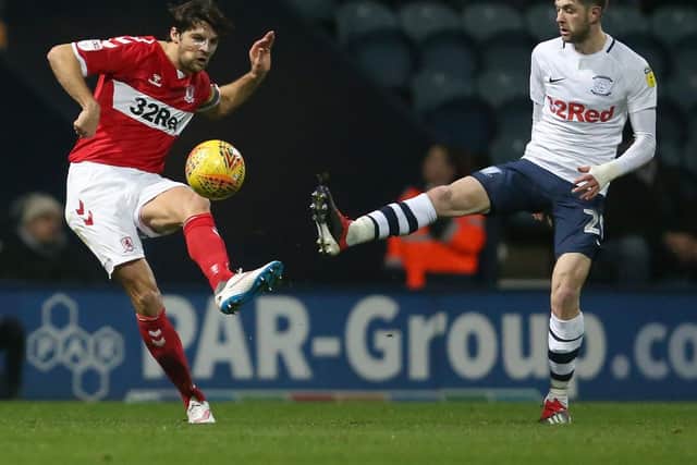 George Friend and Tom Barkhuizen battle for the ball during the meeting between the sides at Deepdale