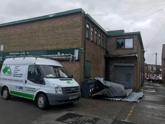 Marc Pattinson, from Total Roofing Solutions, was called in to secure loose sections of roofing on the Leyland Furniture and Carpet shop in Towngate.