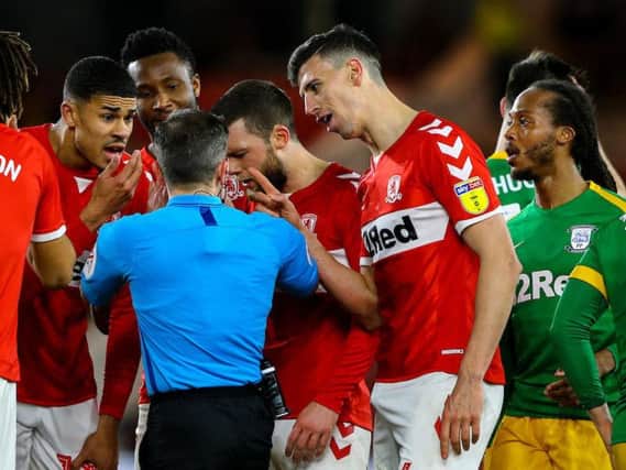 Daniel Ayala protests to referee Keith Stroud after being sent off on Wednesday night