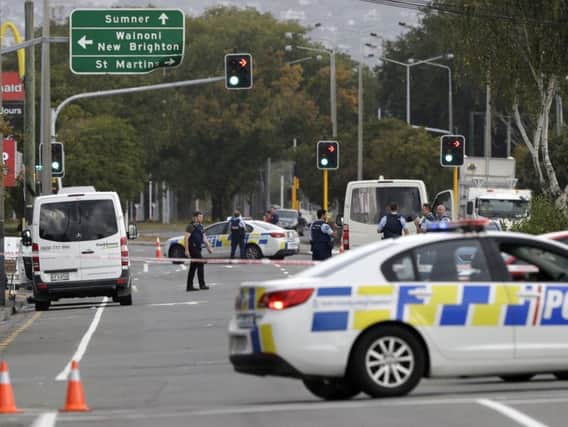Police block the road near the shooting at a mosque in Linwood, Christchurch, New Zealand, Friday, March 15, 2019. Multiple people were killed during shootings at two mosques full of people attending Friday prayers. (AP Photo/Mark Baker)
