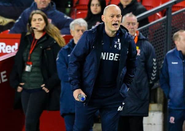 Preston North End manager Alex Neil shouts instructions to his team from the technical area at Middlesbrough