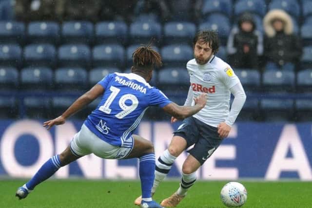 Preston midfielder Ben Pearson takes on Birmingham's Jacques Maghoma