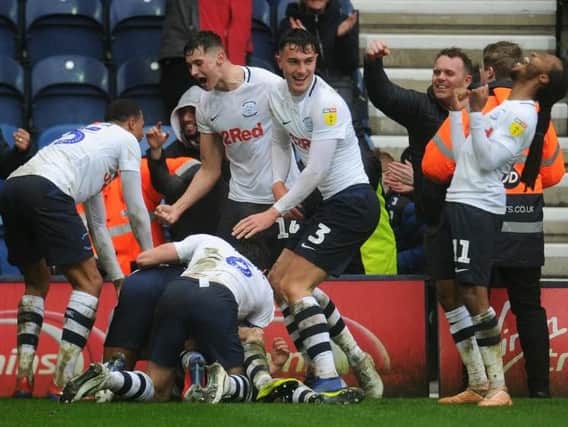 Preston's players celebrate Sean Maguire's stoppage-time winner against Birmingham City at Deepdale