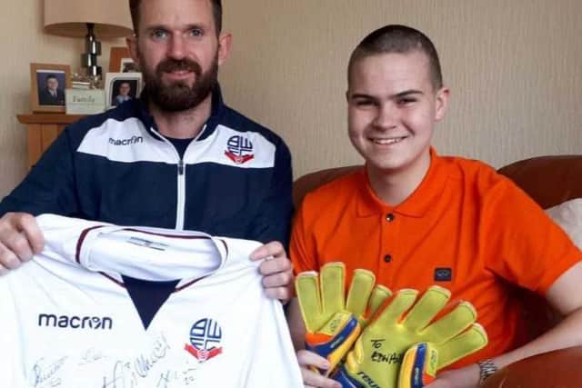 Edward Gregory with former BWFC goalkeeper Mark Howard. Credit: BWFC