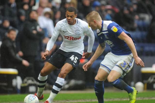 Preston striker Lukas Nmecha takes on Birmingham left-back Kristian Pedersen at Deepdale